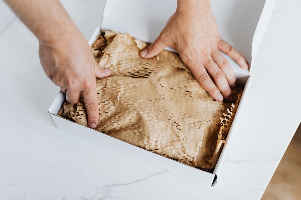 Carefully packaged delivery box being prepared for shipping
